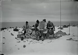 British Antarctic Expedition 1910-13 (Terra Nova) Gallery: Packing a sledge at top of moraine for trip to Shackletons hut. February 11th 1911
