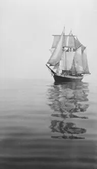 British Graham Land Expedition 1934-37 Gallery: Penola at sea with sails set, reflections in the water