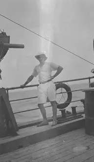 Portrait of a man, A.H. Macklin, standing at the rail of the ship Quest