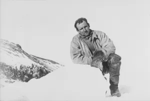 George Murray Levick Gallery: Raymond Priestley leaning on a lump of ice