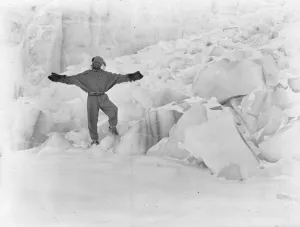 George Murray Levick Gallery: Raymond Priestley standing beside Warning Glacier