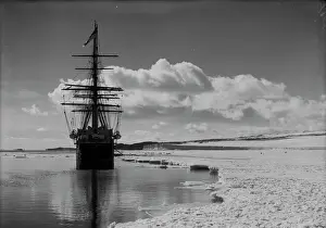 Terra Nova at ice-foot. Barne Cape and glacier in background. January 15th 1911