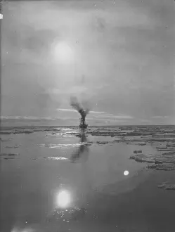 Terra Nova in loose pack. Showing suns reflection on the water