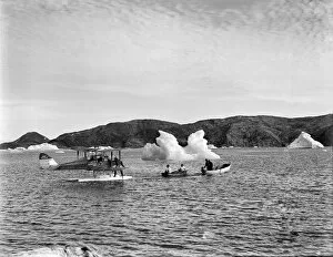 British Arctic Air Route Expedition 1930-31 Collection: Towing moth with outboard motor