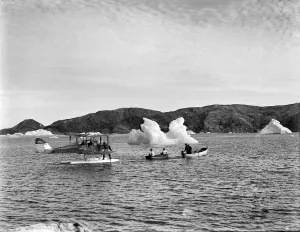 Seaplane Collection: Towing moth with outboard motor