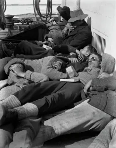 Images Dated 10th April 2015: A warm day in the pack. Expedition members lie in the sun on the deck of the ship Terra Nova